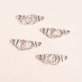 Close-up of silver handcuff charms with Freedom engraving for DIY jewelry making - Handcuffs / Silver