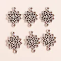 Macro shot of silver plated alloy hollow lotus heart pendants with double loop connectors - Silver