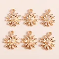 Detailed view of six golden daisy charms with textured centers for DIY jewelry making - Pendant Accessories / Gold