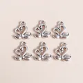 Detailed macro view of vintage silver swan heart pendants for DIY jewelry crafting - Silver