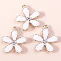 Three white enamel cherry blossom charms with gold trim and crystal center for DIY jewelry - White