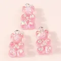 Detailed view of three pink resin gummy bears with sparkly aurora sequins and silver loops - Bright Pink