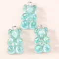 Three mint green resin gummy bear pendants with iridescent sequins and silver loops - Lake Blue