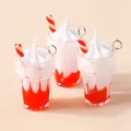 Detailed view of resin strawberry sundae charms with red and white layered design - Red
