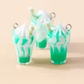 Macro detail of green and white resin ice cream charms with metal loops for DIY jewelry - Green