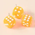 Three orange translucent acrylic dice pendants with silver rings for DIY jewelry making - Orange