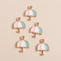 Detailed close-up of macaron enamel umbrella charms with gold plating for DIY jewelry - Umbrella Style