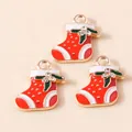 Close-up of red and white enamel Christmas stocking charms with holly leaf details - Red