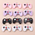 Colorful resin game controller charms in pink, purple, black, and white with metal rings - Multicolor