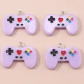 Set of four lavender resin game controller pendants with colorful buttons and metal rings - Purple