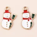 Detail view of cute enamel snowman charms with red hats for Christmas DIY jewelry - White