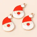 Detailed close-up of three enamel Santa Claus charms with golden metal edges for DIY jewelry - Red