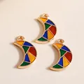 Close-up of colorful moon alloy pendants with geometric enamel mosaic pattern - Colorful