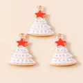 Detailed view of white enamel Christmas tree pendants with gold edges and red star tops - White