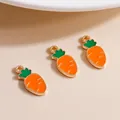 Macro detail of alloy carrot charms with orange enamel and gold metal edges for DIY jewelry - Orange Red