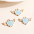 Three light blue enamel heart pendants with golden wings for DIY necklace making - Blue