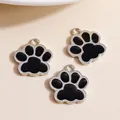 Close-up of black and silver cat paw alloy charms for DIY jewelry making and pendants - Black