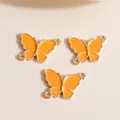 Three orange enamel butterfly connector charms with gold plated finish for DIY jewelry - Yellow