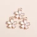 Three cherry blossom charms with gold metal edges, white enamel petals and center rhinestones - White
