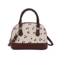 Elegante bolso de mano con forma de concha, estampado de cerezas y adornos de cuero - café