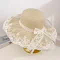 Elegant beige straw beach hat with white floral lace trim and a large side bow detail - Beige Lace Flower