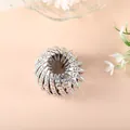 Elegant silver bird's nest hair clip with iridescent rhinestones for buns and ponytails - Silver Rhinestone Style