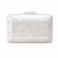 Detailed view of the white acrylic shell clutch with crushed pearl texture and clasp - White