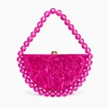 Macro shot of rose red acrylic evening bag with marble texture and beaded handle - Rose Red