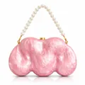 Detail view of pink acrylic shell evening bag with luxury white pearl handle and gold clips - Pink