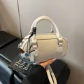 Chic beige lychee grain bowling bag with rocking horse charm and silver hardware - With Pendant / Off White