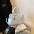 Light gray minimalist square handbag with silver ball accents and detachable shoulder strap - No Pendant / Blue