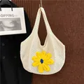 Off-white crochet knit tote bag featuring a large 3D yellow flower for summer beach use - Off White