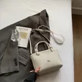 Chic cream woven bucket bag with knot handles and adjustable shoulder strap - Rice White (No Pendant)