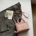 Pink woven texture crossbody bucket bag with metallic logo and knot handle - Pink Without Pendant