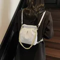 Light grey quilted bucket backpack with golden chain and drawstring for women - Small / Light Blue
