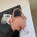 Pink mini bucket bag with silver metal letters and adjustable shoulder strap for women - Pink Without Pendant