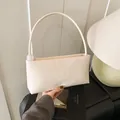 Minimalist cream white shoulder bag in glossy faux leather with marble bead detail - White