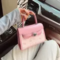 Pink and beige crossbody bag with cute cartoon motifs and elegant top handle - Pink