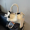 Creamy white woven pattern tote bag with flower charm and matching pouch wallet - Off White