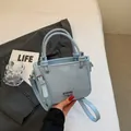 Light blue bucket bag in premium textured leather with round handle and silver hardware - Blue Without Charm