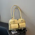 Minimalist light yellow patent leather bowling bag with twin front buckle pockets - Yellow