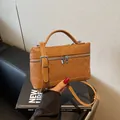 Brown square box handbag with classic diamond quilted stitching and silver hardware - Brown