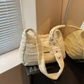 Cream quilted hobo bag with wavy stitching and wide adjustable grommet strap - 34*14*26 / Yellow