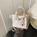 Creamy white PU leather bucket bag with lace bow and pearl heart charm in elegant style - Cream White with Bowknot Heart Pendant