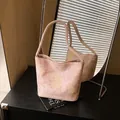 Light pink bucket bag with yellow floral pattern and adjustable long strap - Pink