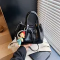 Fashionable black glossy pleated bucket bag with pearl strap and cartoon pendant - 21*11*15 / Black With Rabbit Pendant