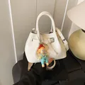 Cream pleated bucket bag with adjustable strap and cute cartoon doll charm detail - 21*11*15 / White With Pendant