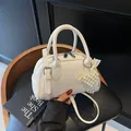 Minimalist white lychee leather handbag with pearl heart pendant and silver hardware - Off-White With Charm