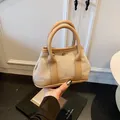 Khaki and beige canvas tote bag with leather trim and metal twist lock detail - Khaki (Small Without Charm)