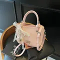 Pink lychee leather bucket bag with lace pearl charm and thin shoulder strap - Bow Charm Style / Pink